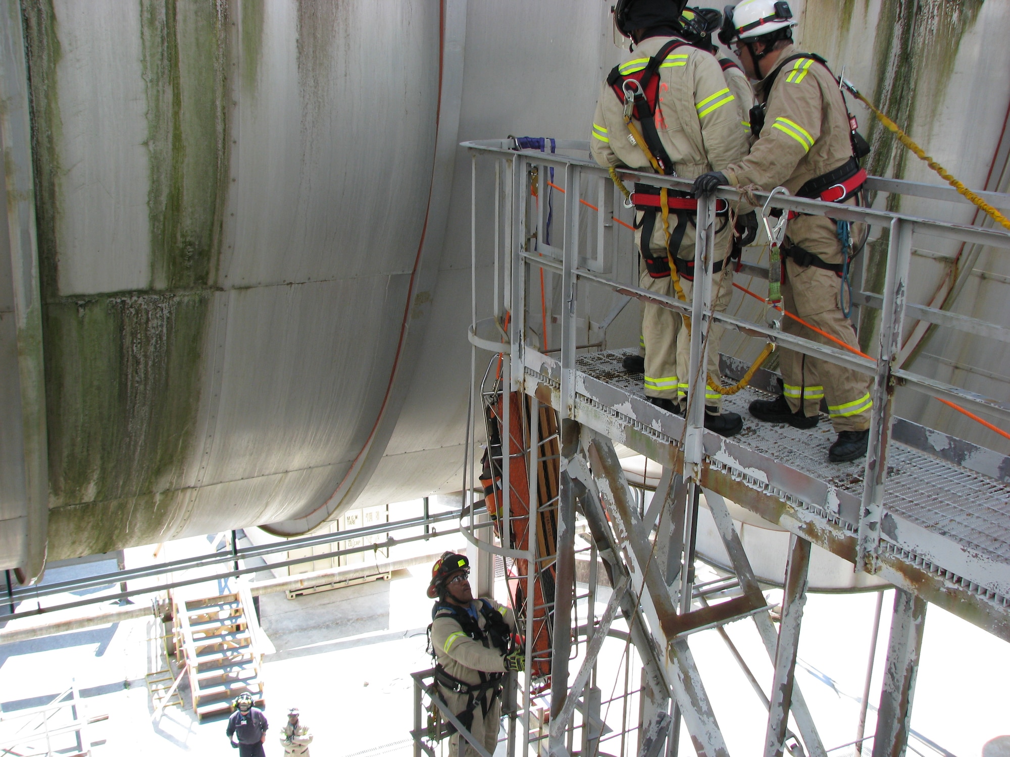 Prior to renovation work, members of Arnold Fire and Emergency Services conduct a training exercise raising a simulated victim out of a cooler. Conducting exercises such as this allows the Arnold Fire and Emergency Services team to have safe, more efficient and effective rescue operations. (AEDC photo)
