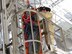 As part of an exercise, a firefighter with the Arnold Fire and Emergency Services team at Arnold Air Force Base raises a simulated victim out of an industrial work area on base prior to lowering the simulated victim over the side of the catwalk and then safely bringing the simulated victim to the ground. (AEDC photo)