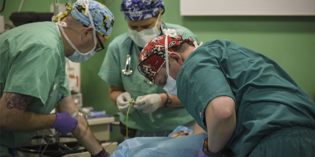 Doctors perform surgery in Honduras.