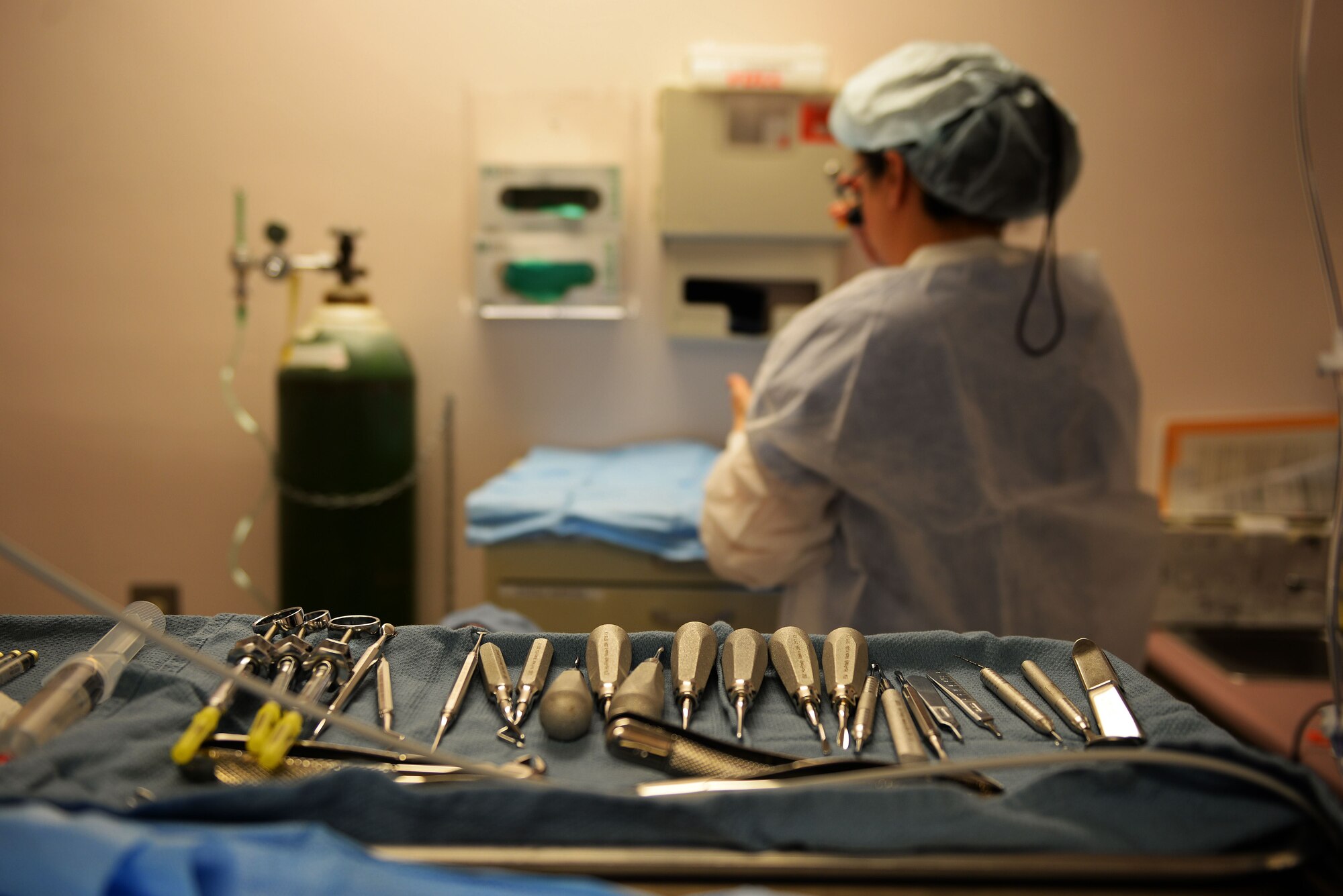 U.S. Air Force Maj. Jamie Smith, 20th Dental Squadron dental flight commander, prepares to perform a wisdom teeth surgery at Shaw Air Force Base, S.C., Jan. 17, 2018.