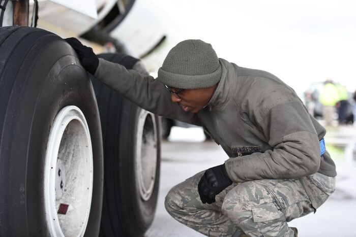 Senior Airman Christian Sharpe, 721st Air Maintenance Squadron crew chief, inspects the tire pressure on the United States National Aeronautics and Space Administration Armstrong Flight Research Center aircraft on Jan. 18, 2018 at Ramstein Air Base. According to a memorandum of agreement between the 721st AGOW and NASA, the 721st AGOW provided primary parking and towing services for the NASA research aircraft. (U.S. Air Force photo by Airman 1st Class Kristof J. Rixmann)