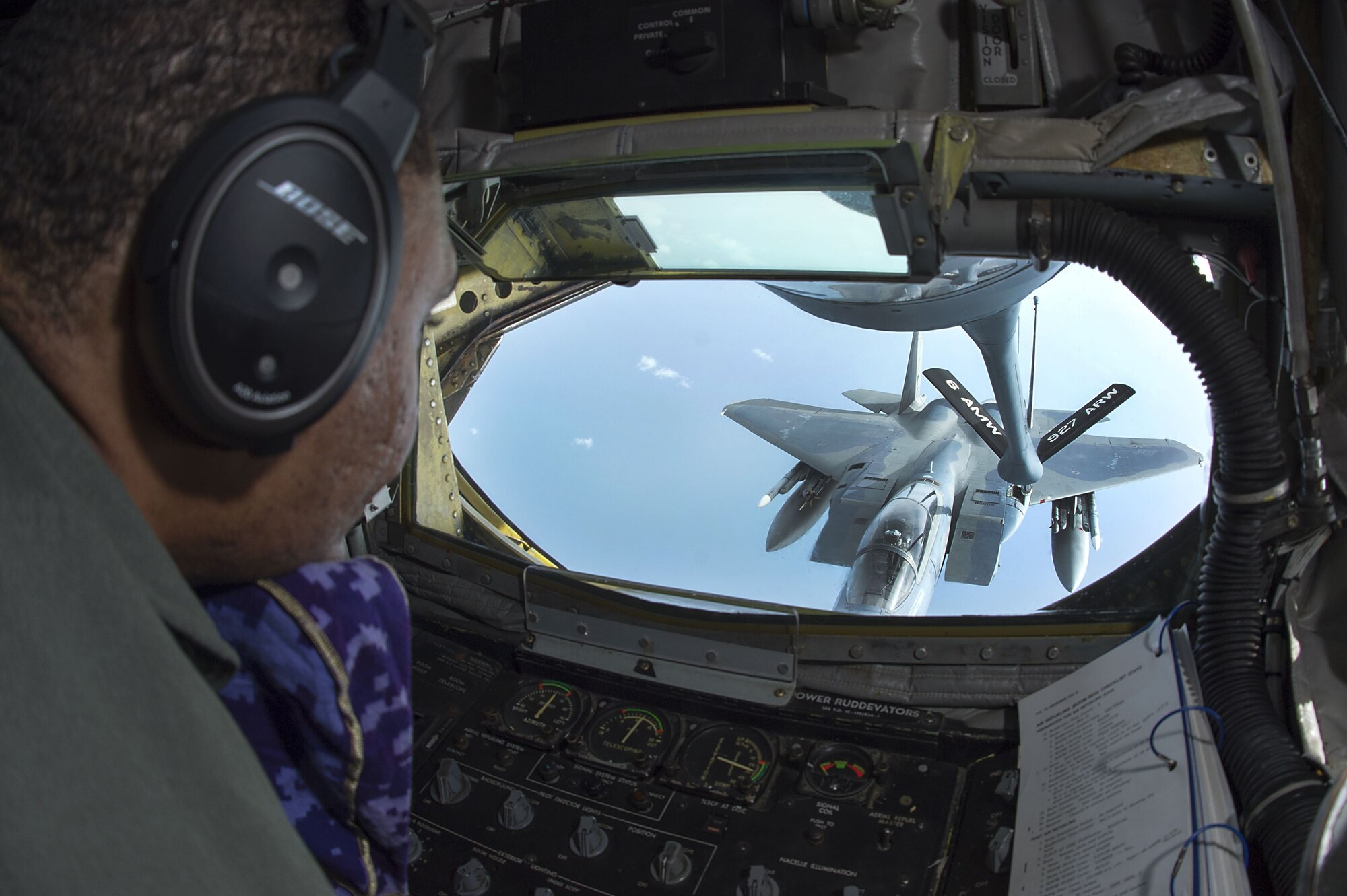 U.S. Air Force Staff Sgt. Jamar Campbell, a boom operator assigned to the 50th Air Refueling Squadron (ARS) prepares to make contact with an F-15 Eagle aircraft during the first 50th ARS training mission at MacDill Air Force Base, Fla., Jan. 16, 2018. As the 50th ARS settles in, their goal is to have one flight per day. (U.S. Air Force photo by Airman 1st Class Caleb Nunez)