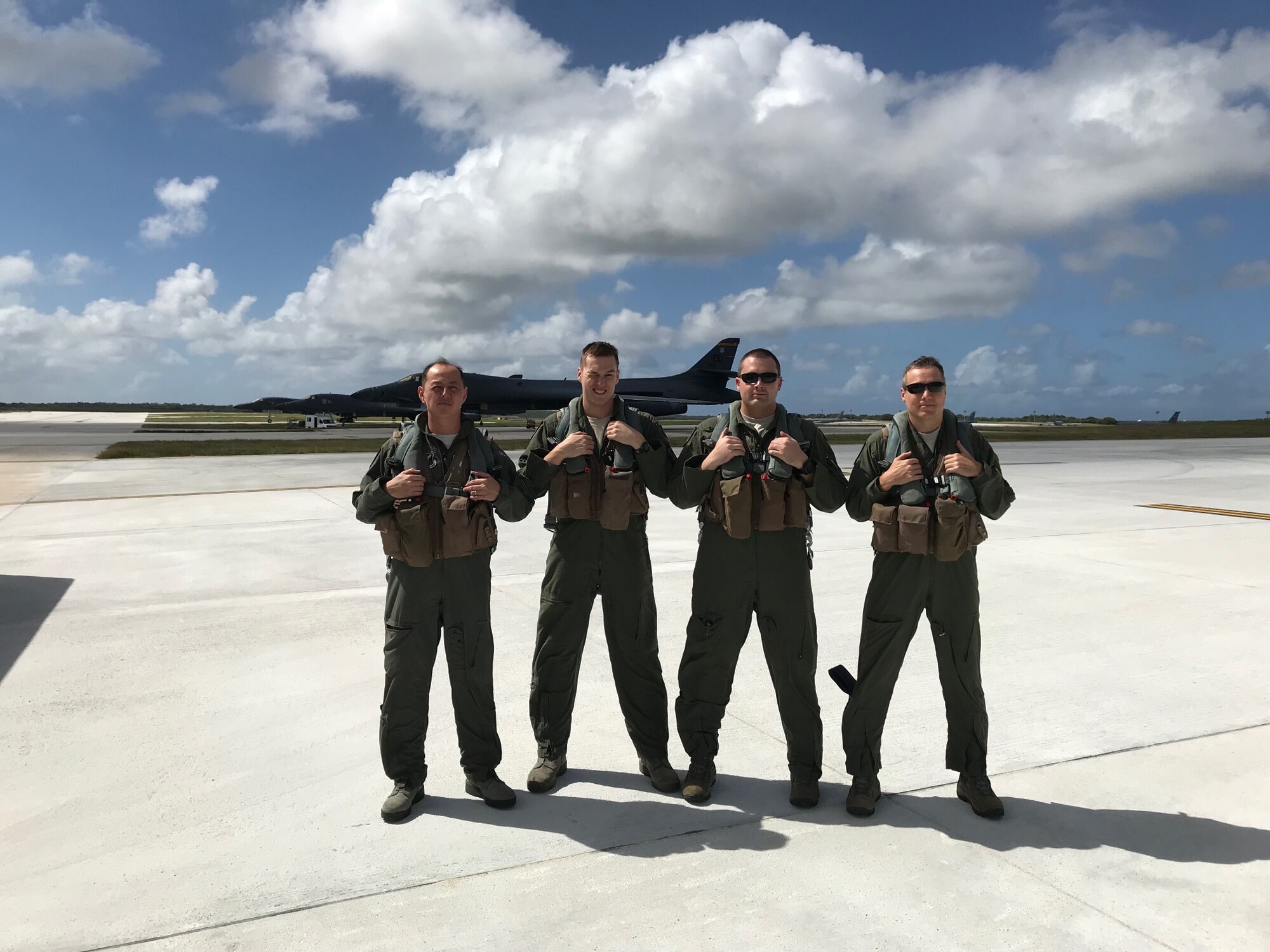 Col. John R. Edwards, the 28th Bomb Wing Commander, stands with other B-1 Bomber aircrew members from the 37th Bomb Squadron at Anderson Air Force Base, Guam. Ellsworth deployed Airmen from the 37th BS to help with the Continuous Bomber Presence operation that is being conducted by the Air Force Pacific Command. (Courtesy photo)