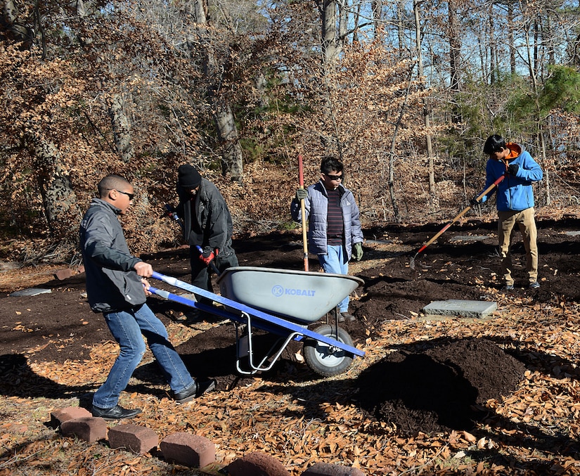 Fort Eustis Boys Scouts Troop 45 members work on a restoration project for a cemetery plot at Joint Base Langley-Eustis, Va., Jan. 20, 2018.