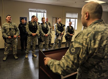 Tech. Sgt. Christopher Marino, 628th Security Forces Squadron flight sergeant briefs security forces Airmen during a shift change, which is called a guard mount Jan. 12, 2018, at Joint Base Charleston, S.C.