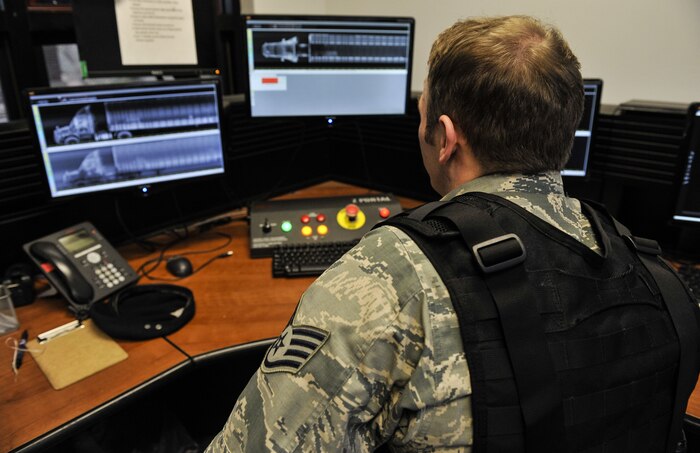 Staff Sgt. Austin Sweet, 628th Security Forces Squadron patrolman, inspects a truck attempting to gain base access through Z-Portal scans Jan. 12, 2018, at Joint Base Charleston, S.C. The Z-Portal takes X-rays of vehicles to show security forces members the vehicle’s contents. It allows them to see weapons inside the vehicle.
