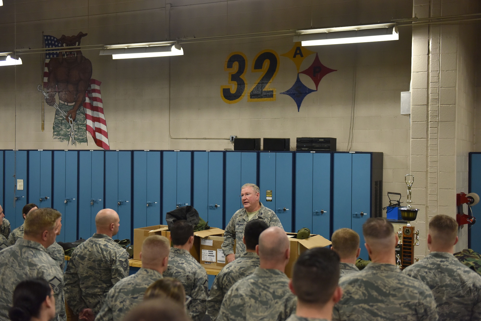 911th Airlift Wing Commander Col. Jeffrey A. Van Dootingh presents the Commander’s Trophy to the 32nd Aerial Port Squadron at the Pittsburgh International Airport Air Reserve Station, Jan. 6, 2018. Team members from the 32nd APS earned the trophy by winning the annual on-base intramural sports competition. (U.S. Air Force photo by Staff Sgt. Marjorie A. Bowlden)