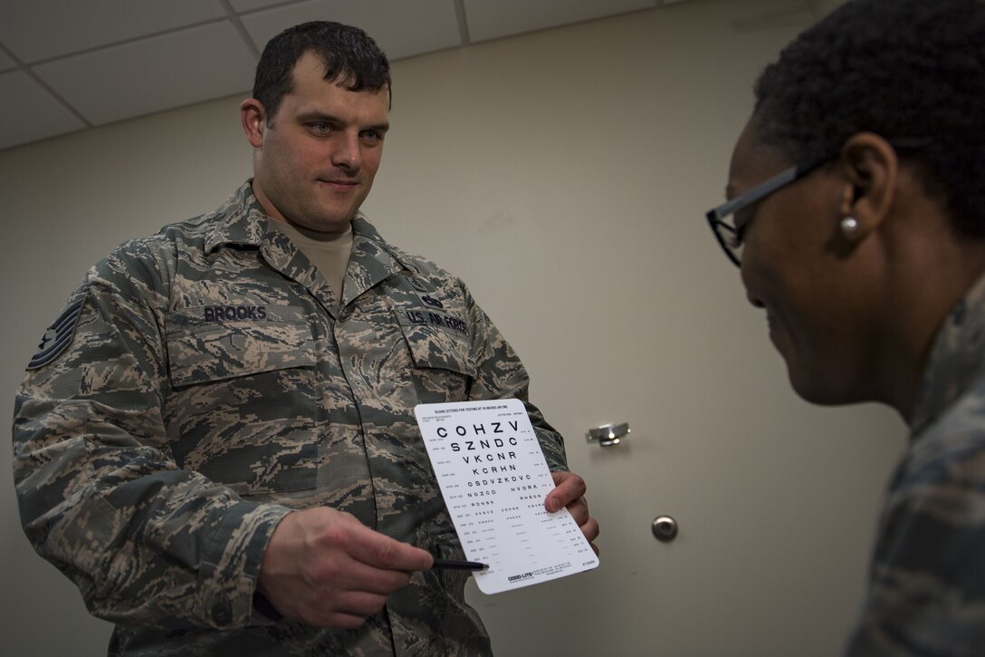 Tech. Sgt. Neal Brooks, 23d Aerospace Medicine Squadron administers a vision test, Jan. 19, 2018, at Moody Air Force Base, Ga. The Biomedical Science Corps became the most diverse corps in the Air Force Medical Services when the Chief of Staff of the Air Force signed a special order on Jan. 28, 1965. (U.S. Air Force photo by Senior Airman Daniel Snider)