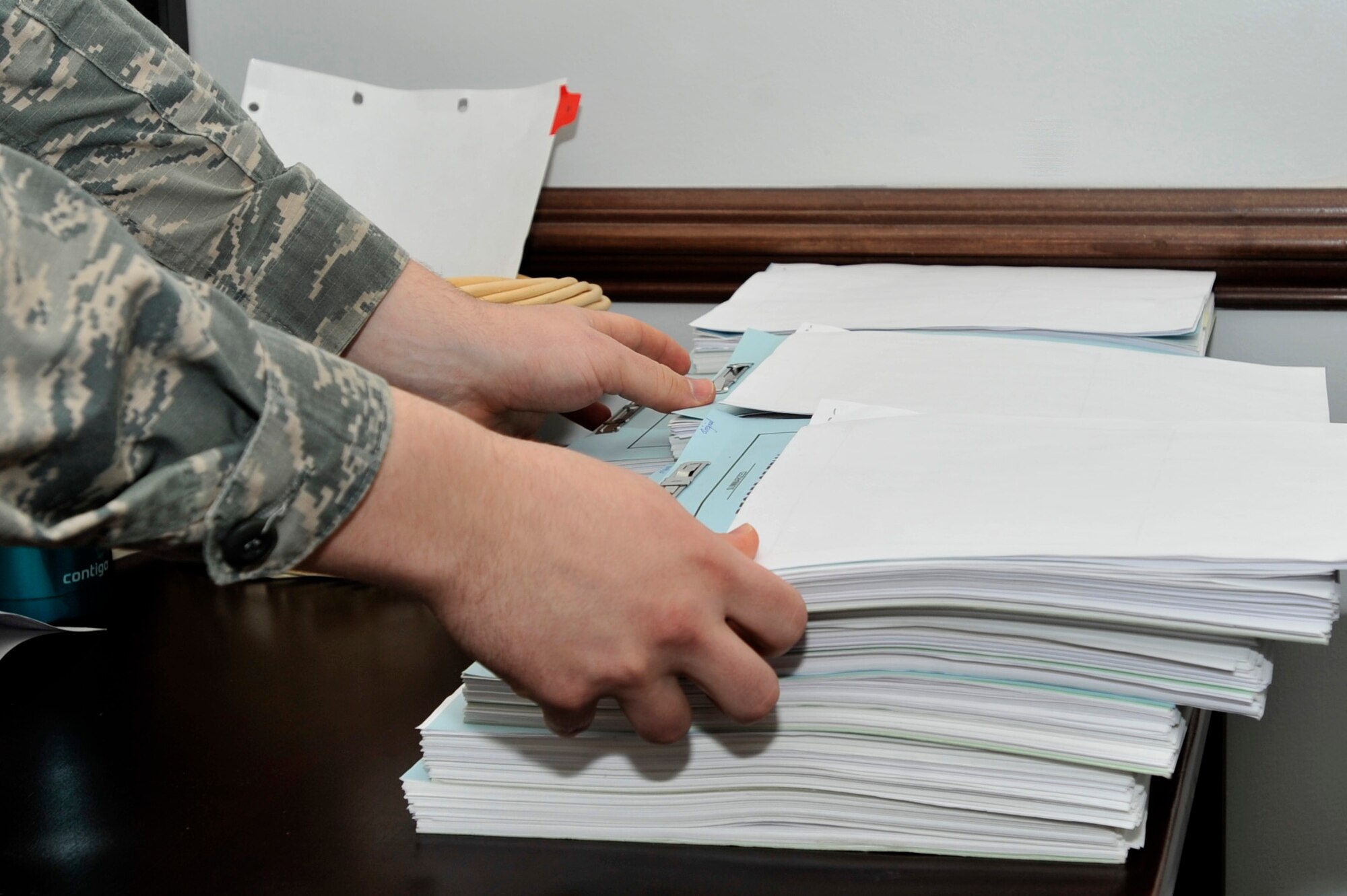 U.S. Air Force Staff Sgt. Justin Spear, 20th Fighter Wing legal office noncommissioned officer in charge of administrative law, adjusts personal legal files at Shaw Air Force Base, S.C., Jan. 17, 2018.