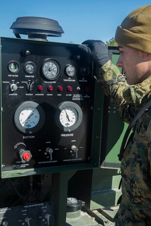 U.S. Marine Corps Cpl. Tyler M. Sampson, Bulk Fuel Specialist, Bulk Fuel Company, 8th Engineer Support Battalion, 2nd Marine Logistics Group, observes a Tactical Fuel System during a training exercise held at Engineer Training Area 2 aboard Camp Lejeune, N.C., Jan. 12, 2018. The exercise was designed to increase proficiency while sustaining ground readiness and combat capability of II Marine Expeditionary Force. (U.S. Marine Corps photo by Lance Cpl. Tyler W. Stewart)