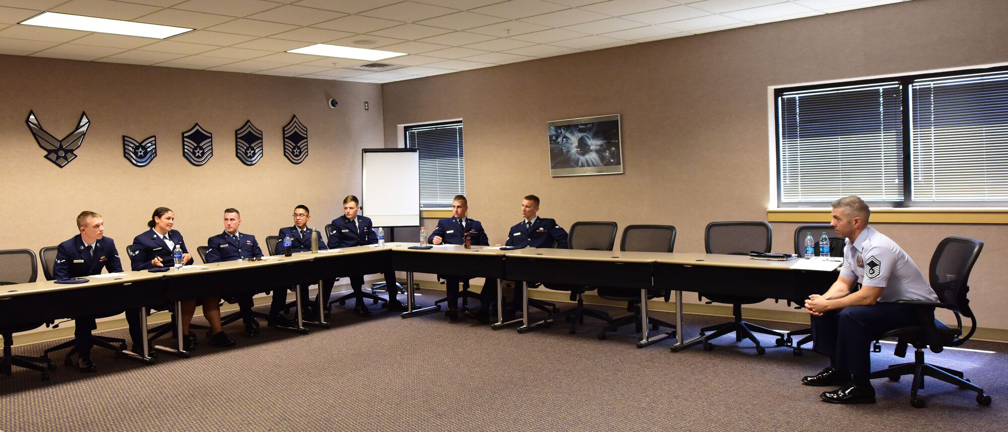 First Term Airman Course students engage in a discussion about professionalism at Whiteman Air Force Base, Mo., July 24, 2017. FTAC is a five-day class that consists of briefs from different base agencies, 13 hours of professionalism training that helps Airmen transition from a training environment to operational Air Force. (U.S. Air Force photo/Staff Sgt. Danielle Quilla)