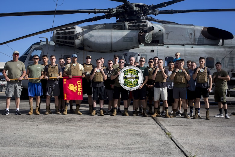 U.S. Marines with Marine Heavy Helicopter Squadron 463 (HMH-463) pose for a photo before beginning a unit memorial hike, Marine Corps Base Hawaii, Jan. 11, 2018. The hike commemorated the 12 Marines from the squadron who were lost in a CH-53E crash while conducting training operations in 2016. While the hike was a solemn reminder of those the squadron lost, it also served as an event to help celebrate the Marines’ lives and the proud traditions of HMH-463. (U.S. Marine Corps Photo by Lance Cpl. Luke Kuennen)