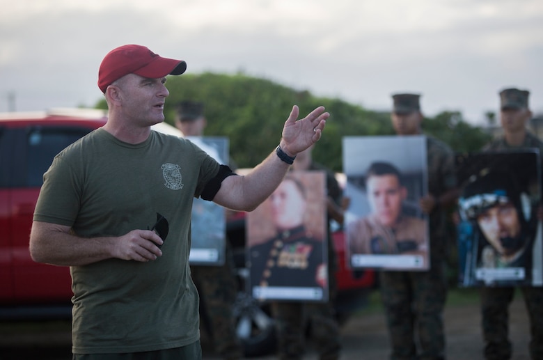 Lt. Col. Kevin Hunter, the commanding officer of Marine Heavy Helicopter Squadron 463 (HMH-463), addresses the squadron upon the completion of their memorial hike, Marine Corps Base Hawaii, Jan. 11, 2018. The hike commemorated the 12 Marines from the squadron who were lost in a CH-53E crash while conducting training operations in 2016. While the hike was a solemn reminder of those the squadron lost, it also served as an event to help celebrate the Marines’ lives and the proud traditions of HMH-463. (U.S. Marine Corps Photo by Lance Cpl. Luke Kuennen)