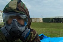 Cpl. Ricardo Furcron, a warehouse clerk with Headquarters and Support Company, Supply Battalion, Combat Logistic Regiment 35, conducts casualty decontamination training on Camp Kinser, Okinawa Jan 23, 2018. This training is held by CLR 35 to reinforce how to effectively help the wounded in case of a chemical, biological, radioactive or nuclear attack. (Marine Corps photo taken by Pfc. Jamin M. Powell)