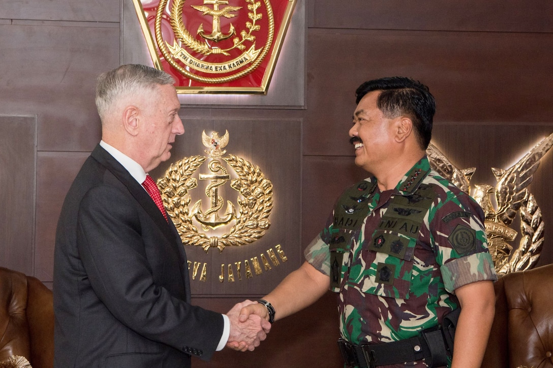 Defense Secretary James N. Mattis shakes hands with Indonesian Defense Chief Marshal Hadi Tjahjanto.
