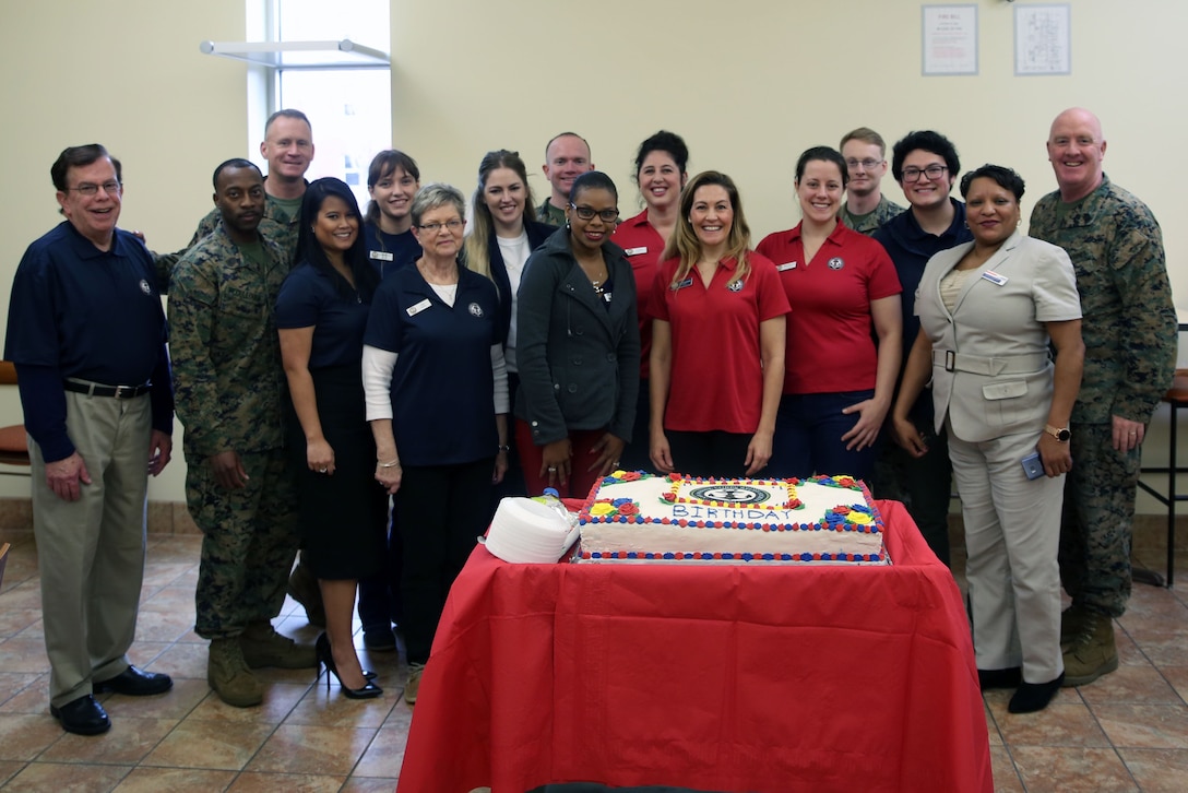 Navy-Marine Corps Relief Society volunteers celebrate the society’s 114th birthday during a celebratory luncheon aboard Marine Corps Air Station Cherry Point, N.C., Jan. 23, 2018. As a non-profit volunteer service organization, the NMCRS uses financial and non-financial resources to identify solutions to meet emerging needs. The cake was provided by food service specialists at the air station’s chow hall. (U.S. Marine Corps Photo by Pfc. Andrew King/ Released)