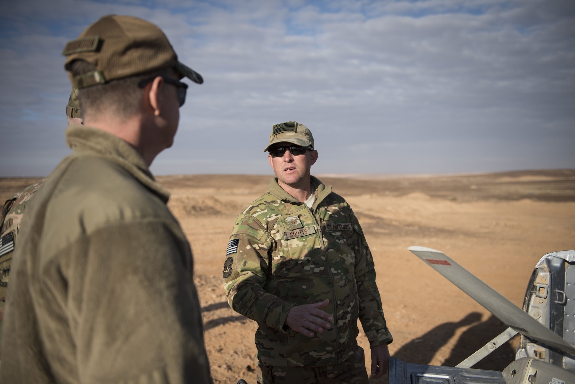 Tech Sgt. Matthew Coutts, assigned to the 332d Expeditionary Security Forces Squadron, demonstrates the capabilities of the Raven B Digital Data Link drone for Brig. Gen. Kyle Robinson, 332d Air Expeditionary Wing commander, Jan. 24, 2018 in Southwest Asia. Prior to deployment, selected Security Forces members received specialized training on maintenance and operation of the system. (U.S. Air Force photo by Staff Sgt. Joshua Kleinholz)