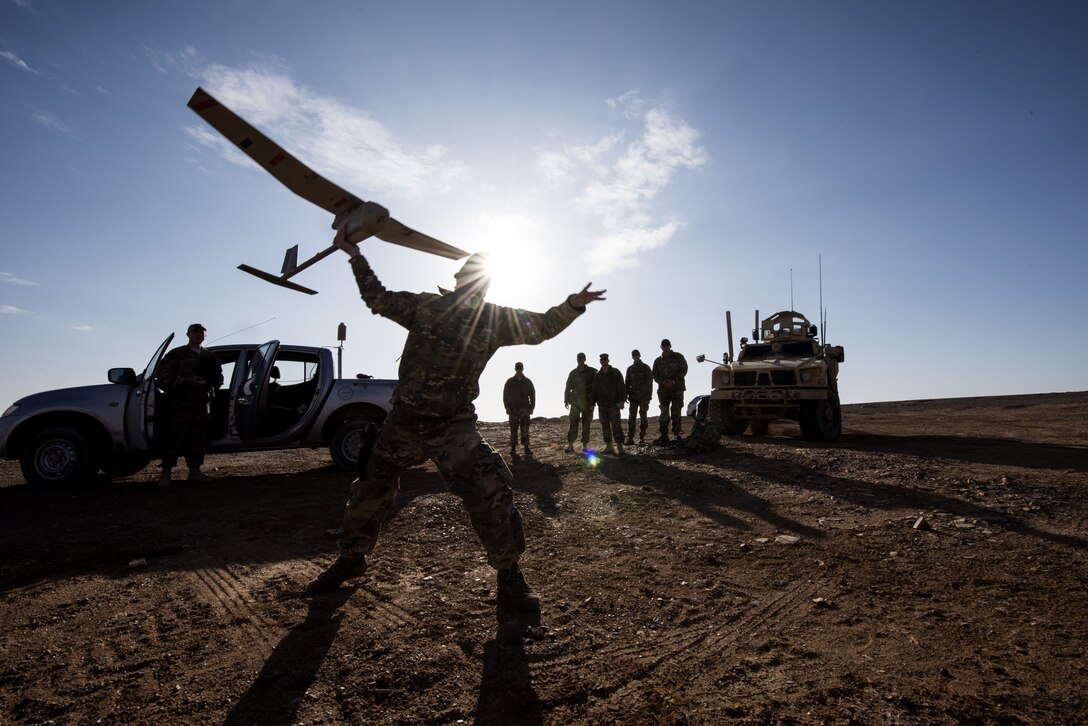 Tech Sgt. Matthew Coutts, assigned to the 332d Expeditionary Security Forces Squadron, launches a Raven B Digital Data Link drone during a demonstration Jan. 24, 2018 in Southwest Asia. After takeoff, the Raven B uses battery power to patrol the air for 60-90 minutes at a time.  (U.S. Air Force photo by Staff Sgt. Joshua Kleinholz)