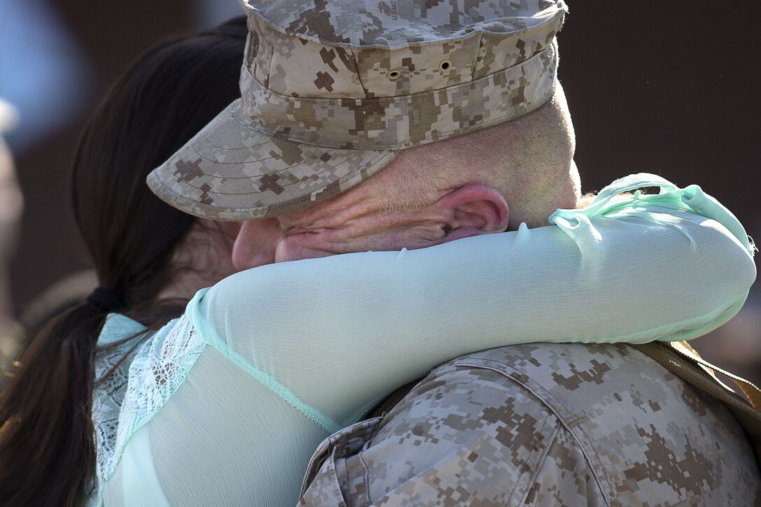 U.S. Marines and sailors assigned to Task Force Southwest are greeted by friends and family after returning from a nine-month deployment to Helmand Province, Afghanistan Jan. 21, 2018 on Marine Corps Base Camp Lejeune, N.C. The Task Force of roughly 300 personnel from II Marine Expeditionary Force deployed in Spring of 2017 in support of the NATO-led Resolute Support mission. Led by Brig. Gen Roger B. Turner, the Task Force trained and advised key leaders within the Afghan National Army 215th Corps and the 505th Zone National Police. The redeployment of the Marines and sailors is the largest since 1st Battalion, 2nd Marines concluded the Marine Corps’ combat role in Afghanistan in late 2014. They transferred authority to a new rotation of Marines, led by Brig. Gen. Benjamin T. Watson, at Camp Shorab, January 15, 2018. (U.S. Marine Corps photo by Sgt. Matthew Callahan)