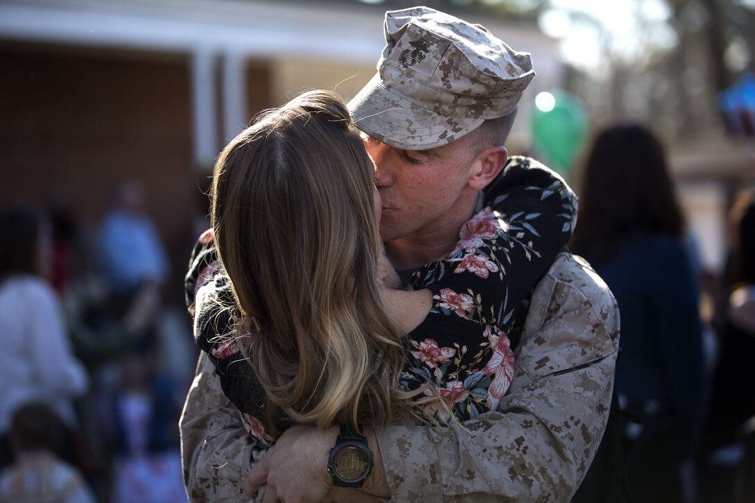 U.S. Marines and sailors assigned to Task Force Southwest are greeted by friends and family after returning from a nine-month deployment to Helmand Province, Afghanistan Jan. 21, 2018 on Marine Corps Base Camp Lejeune, N.C. The Task Force of roughly 300 personnel from II Marine Expeditionary Force deployed in Spring of 2017 in support of the NATO-led Resolute Support mission. Led by Brig. Gen Roger B. Turner, the Task Force trained and advised key leaders within the Afghan National Army 215th Corps and the 505th Zone National Police. The redeployment of the Marines and sailors is the largest since 1st Battalion, 2nd Marines concluded the Marine Corps’ combat role in Afghanistan in late 2014. They transferred authority to a new rotation of Marines, led by Brig. Gen. Benjamin T. Watson, at Camp Shorab, January 15, 2018. (U.S. Marine Corps photo by Sgt. Matthew Callahan)
