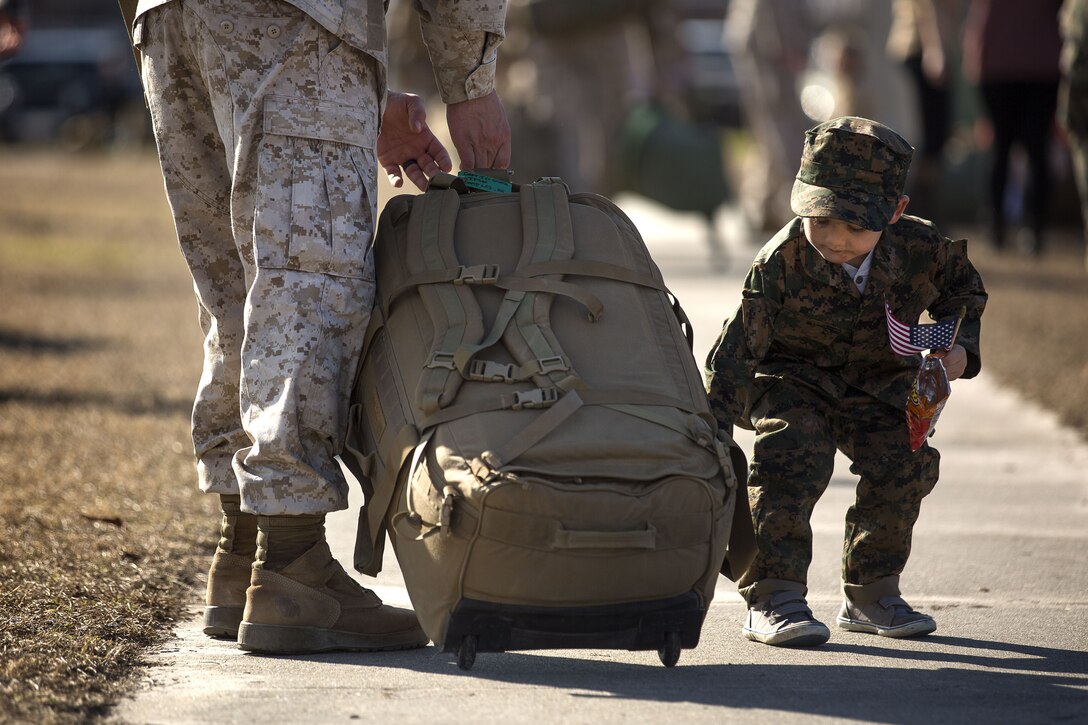 U.S. Marines and sailors assigned to Task Force Southwest are greeted by friends and family after returning from a nine-month deployment to Helmand Province, Afghanistan Jan. 21, 2018 on Marine Corps Base Camp Lejeune, N.C. The Task Force of roughly 300 personnel from II Marine Expeditionary Force deployed in Spring of 2017 in support of the NATO-led Resolute Support mission. Led by Brig. Gen Roger B. Turner, the Task Force trained and advised key leaders within the Afghan National Army 215th Corps and the 505th Zone National Police. The redeployment of the Marines and sailors is the largest since 1st Battalion, 2nd Marines concluded the Marine Corps’ combat role in Afghanistan in late 2014. They transferred authority to a new rotation of Marines, led by Brig. Gen. Benjamin T. Watson, at Camp Shorab, January 15, 2018. (U.S. Marine Corps photo by Sgt. Matthew Callahan)