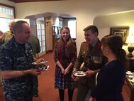 U.S. Navy Adm. Charles Richard (left), deputy commander of U.S. Strategic Command (USSTRATCOM), and Australian Army Col. Gregory Novak (second from right), Australian liaison to USSTRATCOM, speak during an Australia Day recognition event at Offutt Air Force Base, Neb., Jan. 23, 2018.  Novak hosted USSTRATCOM leaders and liaison officers from the United Kingdom, Denmark, Canada and the Republic of Korea at the event. Australia Day is celebrated on January 26 each year on the anniversary of Britain’s First Fleet arriving at Port Jackson, New South Wales in 1788. (U.S. Navy photo by Capt. Brook DeWalt)
