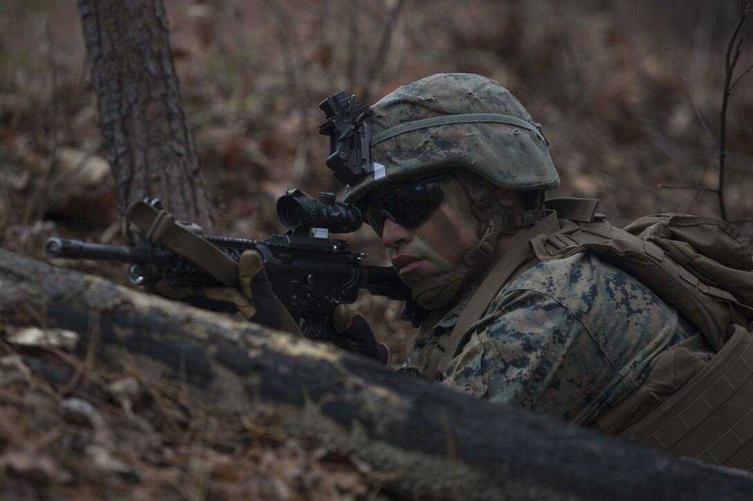 Lance Cpl. Branson Benavidez, a Marine with 2nd Battalion, 8th Marine Regiment, posts security during a patrol at a platoon live-fire range during a deployment for training exercise at Fort A.P. Hill, Va., Dec. 7, 2017. The Marines are conducting the training to maintain proficiency at the squad, platoon, company, and battalion-level of warfighting in preparation for an upcoming deployment to Japan. The Marines patrolled, detonated Bangalore torpedoes to breach obstacles, threw M67 fragmentation grenades to clear trenches, and conducted live-fire movements to take an objective. (U.S. Marine Corps photo by Lance Cpl. Ashley McLaughlin)