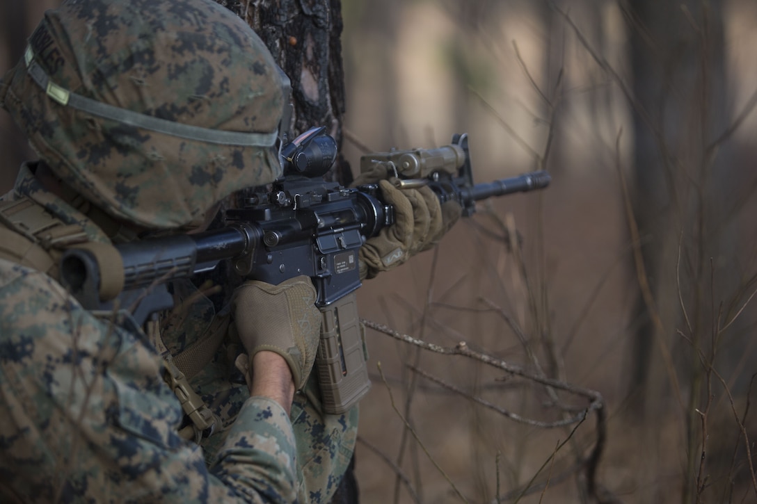 A Marine with 2nd Battalion, 8th Marine Regiment provides suppression at a platoon live-fire range during a deployment for training exercise at Fort A.P. Hill, Va., Dec. 7, 2017. The Marines are conducting the training to maintain proficiency at the squad, platoon, company, and battalion-level of warfighting in preparation for an upcoming deployment to Japan. The Marines patrolled, detonated Bangalore torpedoes to breach obstacles, threw M67 fragmentation grenades to clear trenches, and conducted live-fire movements to take an objective. (U.S. Marine Corps photo by Lance Cpl. Ashley McLaughlin)