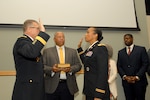 Army Lt. Col. Corrinne Bell, right, reaffirms the oath of the commissioned officer with Brig. Gen. Mark Simerly, commander, during a promotion ceremony at DLA Troop Support in Philadelphia Jan. 19, 2018.