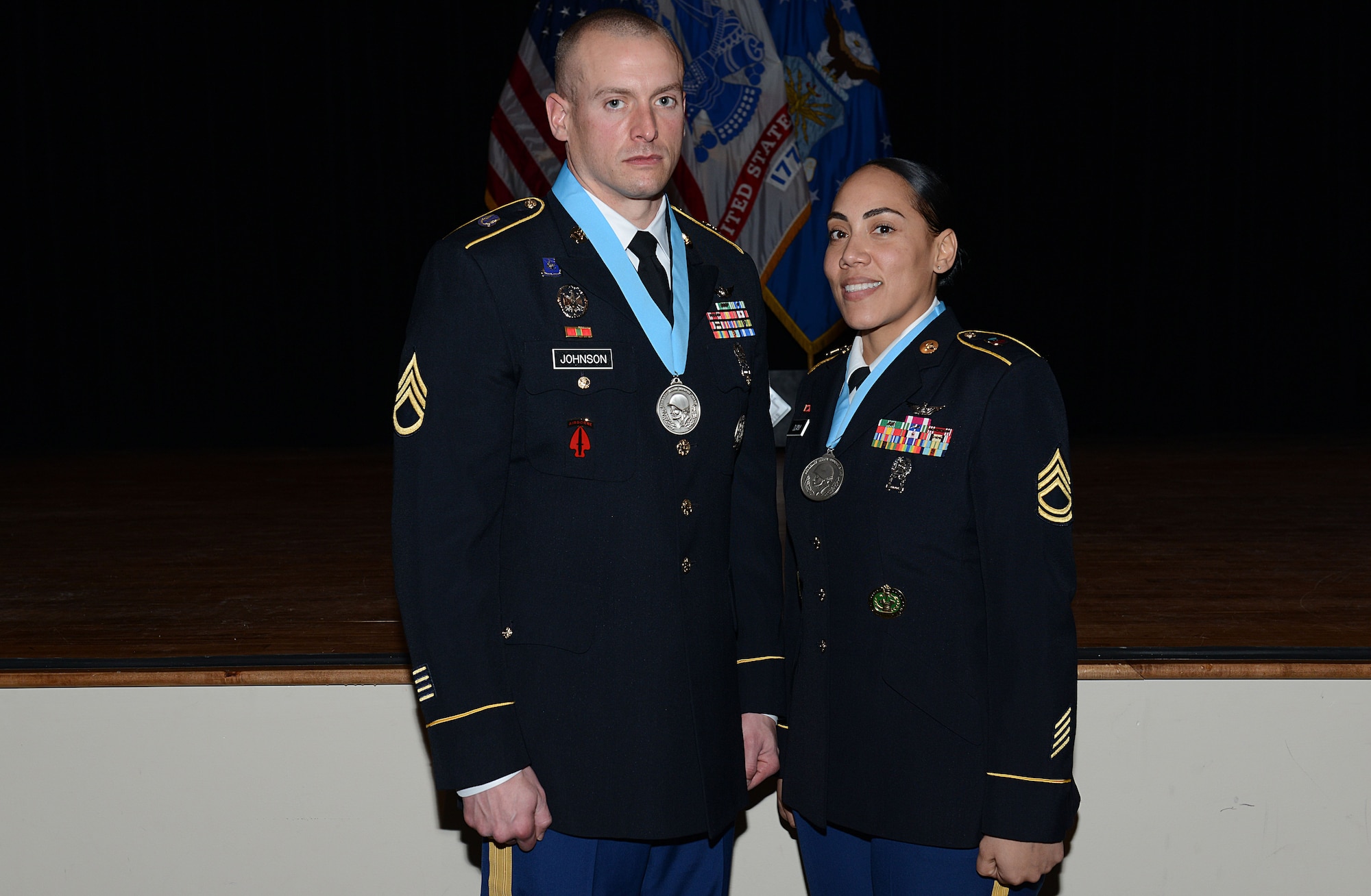 U.S. Army Staff Sgt. Mathew Johnson, Charlie Company, 2nd Battalion, 210th Aviation Regiment, 128th Avn. Bde., instructor writer, poses for a photo with U.S. Army Sgt. 1st Class Charmaine Duany, 128th Avn. Bde., Sexual Assault Response Coordinator and Sergeant Audie Murphy Club president following a SAMC induction ceremony at Joint Base Langley-Eustis, Va., Jan. 21, 2018.