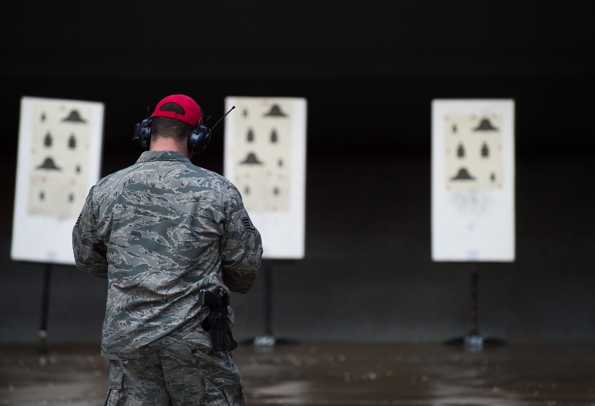 U.S. Air Force Staff Sgt. Garrett Christ, 633rd Security Forces Squadron combat arms training and maintenance range instructor, checks and scores the targets at the combat arms training and maintenance at Joint Base Langley-Eustis, Va., Jan. 23, 2018.