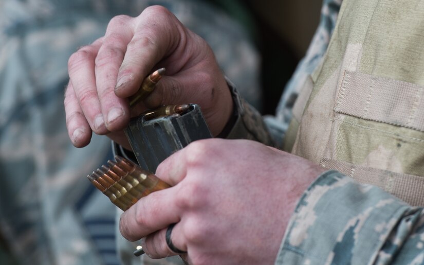 U.S. Air Force Tech. Sgt. Rick Bones, 633rd Civil Engineer Squadron electrical power craftsman, loads 5.56 mm frangible rounds into a magazine during training at the combat arms training and maintenance range at Joint Base Langley-Eustis, Va., Jan. 23, 2018.