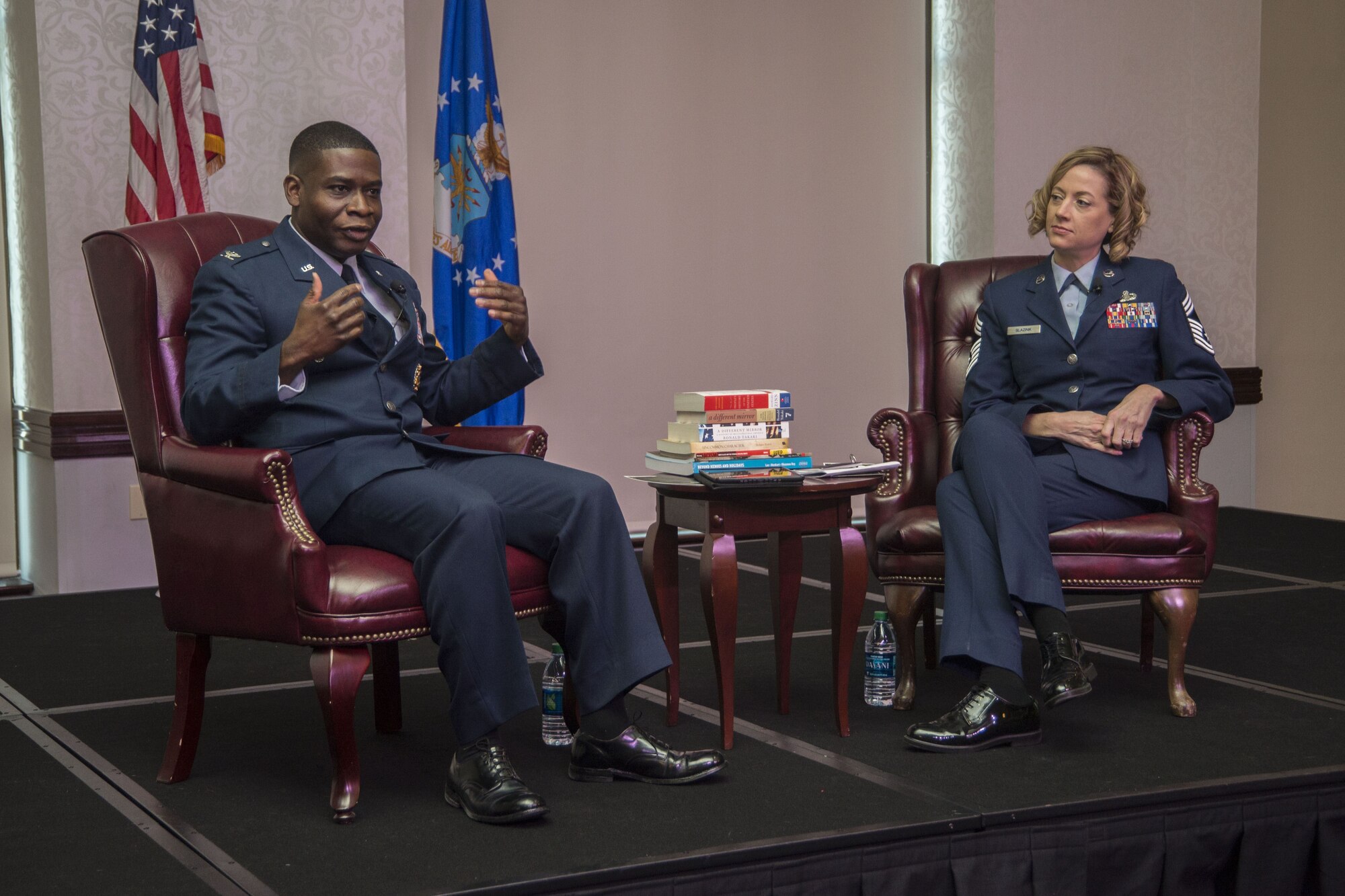 Col. Chris Buschur, 375th Air Mobility Wing commander, presents a certificate to the Scott Air Force Base Youth Center during the Dr. Martin Luther King, Jr., luncheon, Jan. 16, 2017, Scott AFB, Ill. Each room of the youth center participated in a poster design competition about what Dr. King’s legacy means. (U.S. Air Force photo by Senior Airman Melissa Estevez)