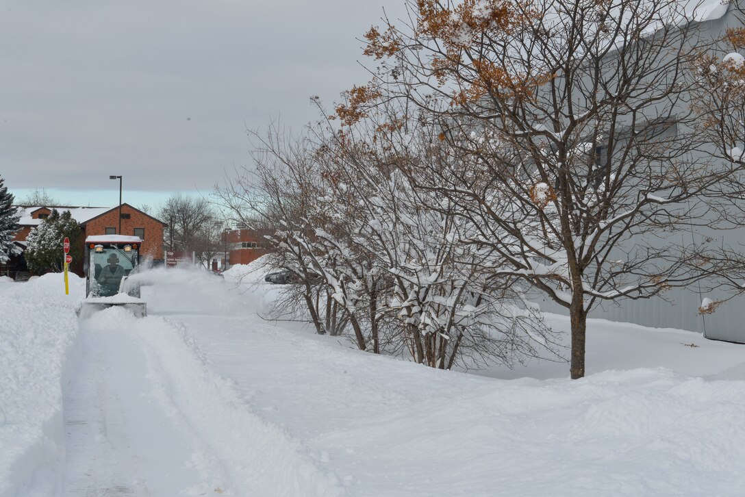Members of the 934th Civil Engineer Squadron cleared sidewalks at the Minneapolis-St. Paul Air Reserve Station, Minn., on Jan. 23, 2018. (U.S. Air Force photo by Master Sgt. Eric Amidon)