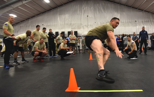 Master Sgt. Kyle Anderson, 3rd Air Support Operations Group, runs between two cones during a speed, strength and agility demonstration at Joint Base Andrews, Md., Jan. 9, 2018. (U.S. Air Force photo by Staff Sgt. Joe Yanik)