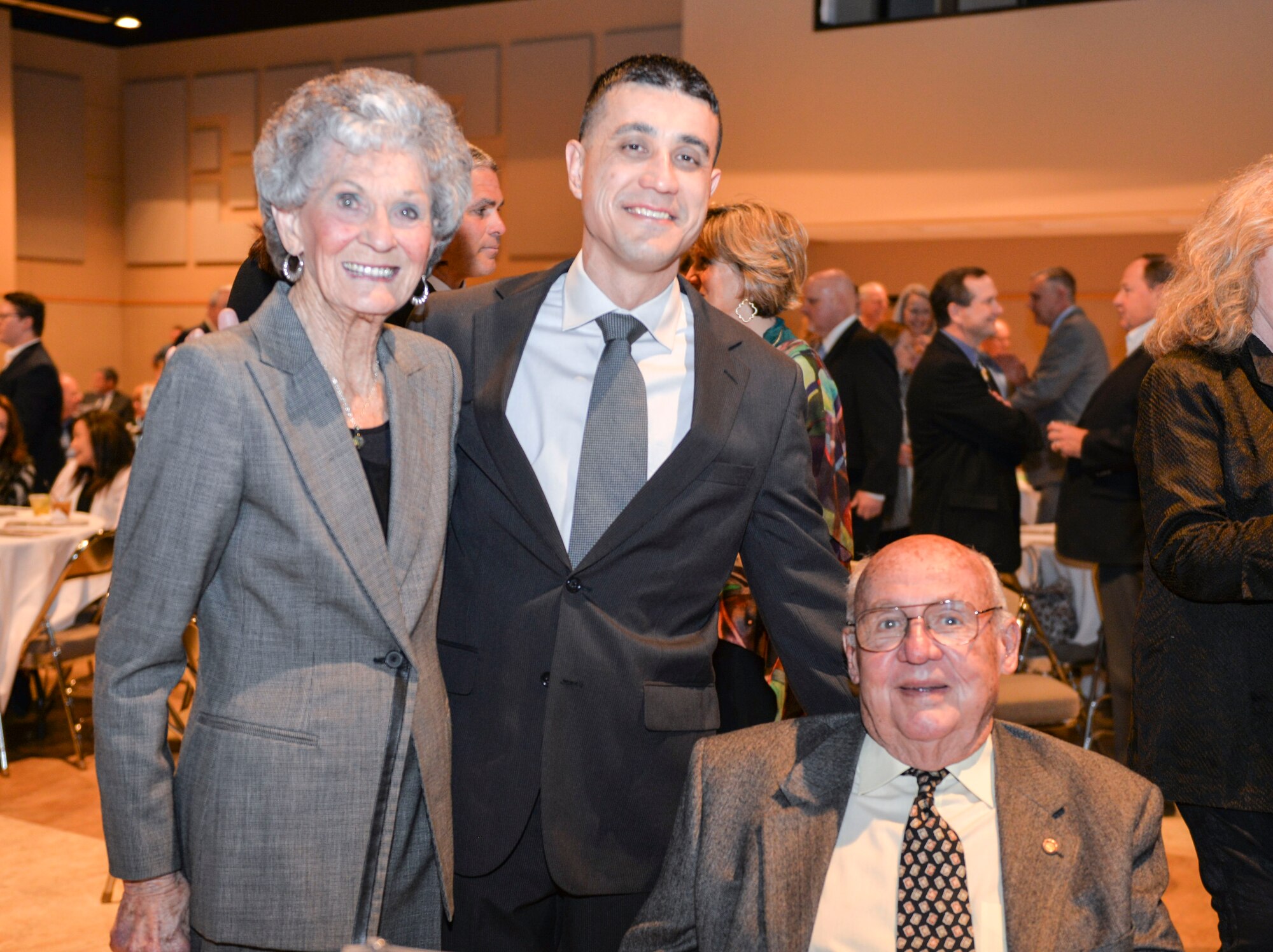 JoAnne Powell, U.S. Air Force Col. Ricky Mills, 17th Training Wing commander, and retired Col. Charles Powell visit during the Chamber of Commerce Annual Awards Banquet at the McNease Convention Center, San Angelo, Texas, Jan. 23, 2018. The Powells have been community leaders for over 30 years after he retired as Goodfellow’s commander in 1984. (U.S. Air Force photo by Aryn Lockhart/Released)