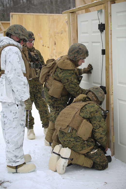 Marines with Company E, 4th Combat Engineer Battalion, 25th Marine Regiment, 4th Marine Division, prepare a charge during exercise Nordica Frost at Camp Ethan Allen Training Site in Jericho, Vt., Jan. 19, 2018. The goal of Nordic Frost was to improve the unit’s environmental capabilities by giving them an introduction to cold weather training and testing their squad and fire team level defensive proficiency in an austere environment. (U.S. Marine Corps photo by Pfc. Samantha Schwoch/released)