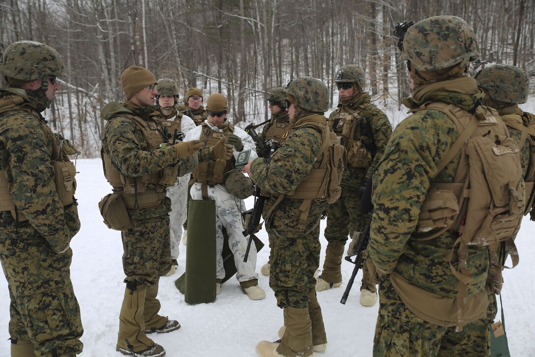 Capt. Clinton Snow, company commander of Company E, 4th Combat Engineer Battalion, 4th Marine Division, briefs Marines on the safety procedures before conducting breach training during exercise Nordic Frost at Camp Ethan Allen Training Site in Jericho, Vt., Jan. 19, 2018. The goal of Nordic Frost was to improve the unit’s environmental capabilities by giving them an introduction to cold weather training and testing their squad and fire team level defensive proficiency in an austere environment. (U.S. Marine Corps photo by Pfc. Samantha Schwoch/released)