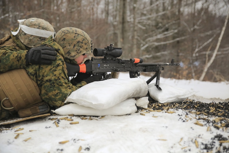 Lance Cpl. Doug Poyner, front, anti-tank missile man with Weapons Company, 1st Battalion, 24th Marines, 25th Marine Regiment, 4th Marine Division, and Lance Cpl. Orlando Pena, rear, rifleman with Co. A, 1st Bn., 24th Marines, 25th Marine Regiment, 4th MarDiv, fire the M240 machine gun during exercise Nordic Frost at Camp Ethan Allen Training Site in Jericho, Vt., Jan. 19, 2018. The exercise allowed Marines to demonstrate their ability to operate in a cold weather mountainous environment, conducting land navigation, marksmanship training, demolitions, call for fire training and other core competencies. (U.S. Marine Corps photo by Pfc. Samantha Schwoch/released)