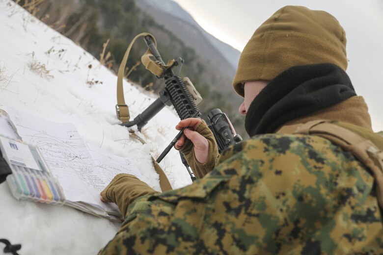 Lance Cpl. Christopher C. Acosta, team leader with Company C, 1st Battalion, 24th Marines, 25th Marine Regiment, 4th Marine Division, practice preparing range cards during exercise Nordic Frost on Camp Ethan Allen in Jericho, Vt., Jan. 20, 2018. The exercise enabled Reserve Marines to spend two weeks working together, battling the elements to ensure that they are ready to fight tonight and respond to the nation’s calls. (U.S. Marine Corps photo by Pfc. Samantha Schwoch/released)
