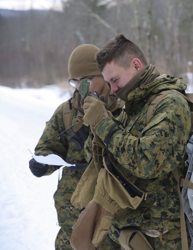 Lance Cpl. Gabriel Amezcua, left, and Pfc. Trenton White, right, riflemen with Company B, 1st Battalion, 24th Marines, 25th Marine Regiment, 4th Marine Division, conduct land navigation training during exercise Nordic Frost at Camp Ethan Allen Training Site in Jericho, Vt., Jan. 20, 2018. Nordic Frost enabled Reserve Marines to spend two weeks working together, battling the elements to ensure that they are ready to fight tonight and respond to the nation’s calls. (U.S. Marine Corps photo by Pfc. Samantha Schwoch/released)