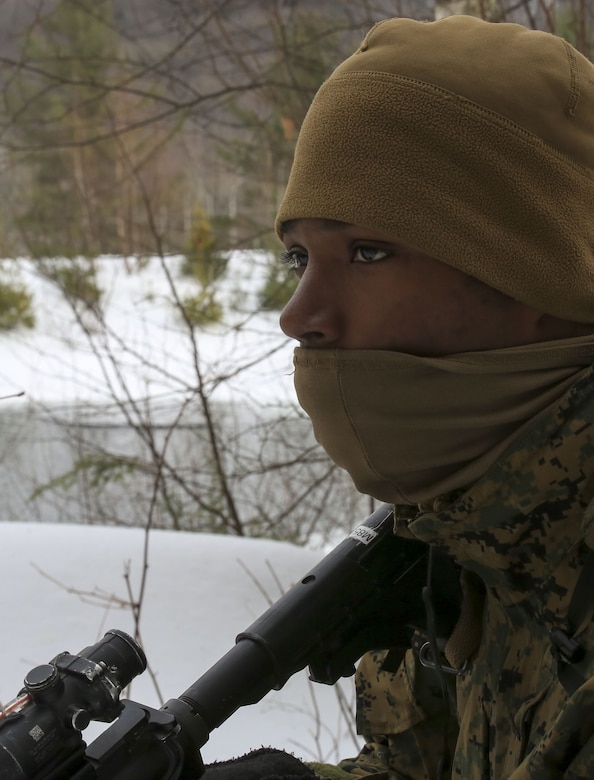 Lance Cpl. Carren Redds, rifleman with Company C, 1st Battalion, 24th Marines, 25th Marine Regiment, practices patrolling techniques during exercise Nordic Frost at Camp Ethan Allen Training Site in Jericho, Vt., Jan. 21, 2018. The exercise allowed Marines to demonstrate their ability to operate in a cold weather mountainous environment, conducting land navigation, marksmanship training, demolitions, call for fire training and other core competencies. (U.S. Marine Corps photo by Pfc. Samantha Schwoch/released)