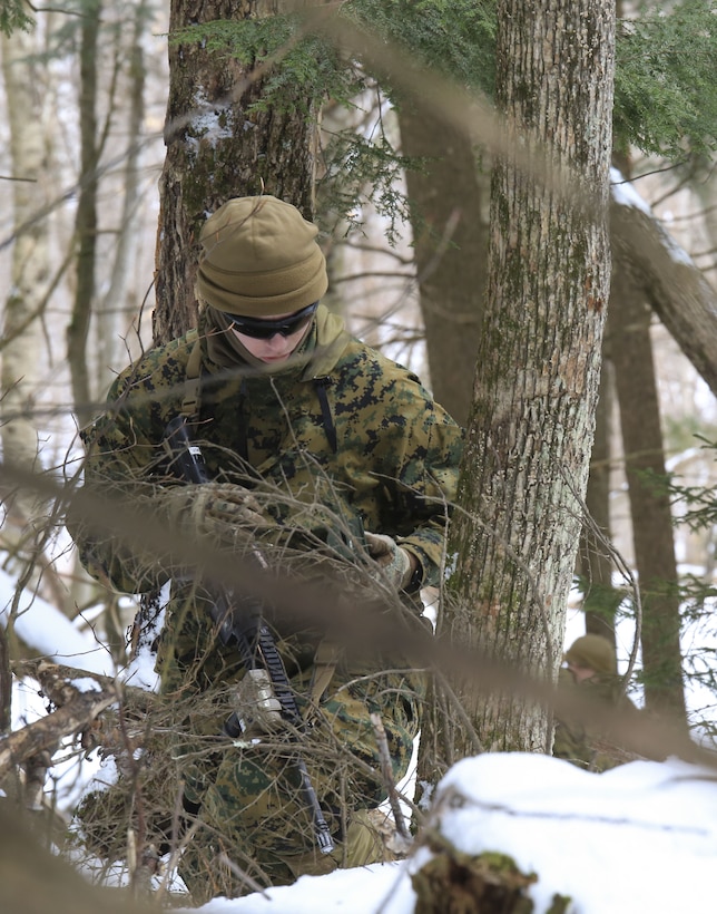 Pvt. Tyrel Smith, rifleman with Company C, 1st Battalion, 24th Marines, 25th Marine Regiment, 4th Marine Division, shoots an azimuth on his compass while dead reckoning during exercise Nordic Frost at Camp Ethan Allen Training Site in Jericho, Vt. Jan. 21, 2018. The exercise allowed Marines to demonstrate their ability to operate in a cold weather mountainous environment, conducting land navigation, marksmanship training, demolitions, call for fire training and other core competencies.  (U.S. Marine Corps photo by Pfc. Samantha Schwoch/released)