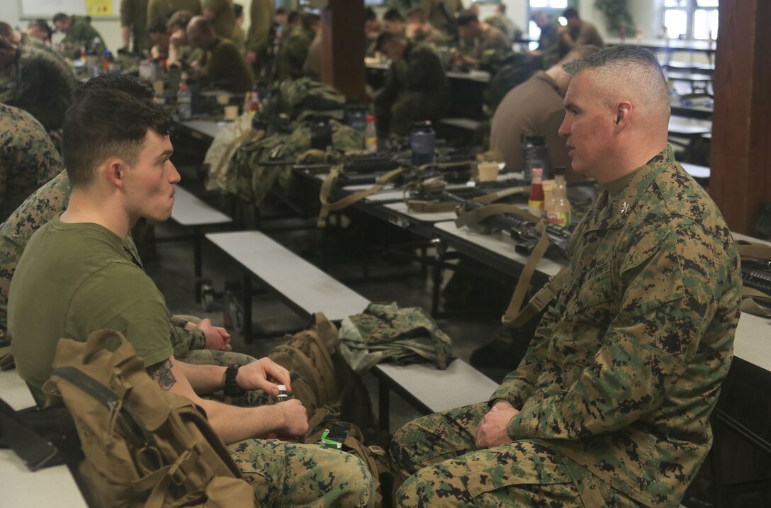 Col. William E. Sousa, right, commanding officer of 25th Marine Regiment, 4th Marine Division, speaks to the junior enlisted Marines of 1st Battalion, 24th Marines, 25th Marines, 4th MarDiv, about their experiences throughout exercise Nordic Frost at Camp Ethan Allen Training Site in Jericho, Vt., Jan. 22, 2018. The exercise allowed Marines to demonstrate their ability to operate in a cold weather mountainous environment, conducting land navigation, marksmanship training, demolitions, call for fire training and other core competencies. (U.S. Marine Corps photo by Pfc. Samantha Schwoch/released)
