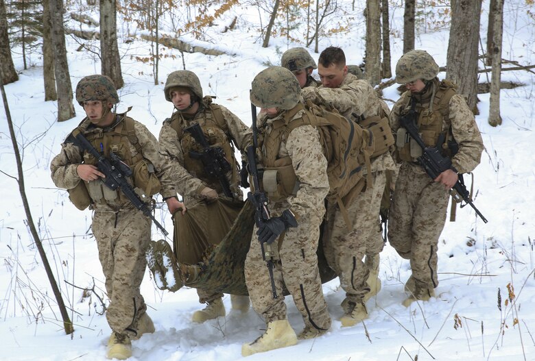Marines with Weapons Company, 1st Battalion, 24th Marines, 25th Marine Regiment, 4th Marine Division, conduct medical evacuation techniques during the final exercise of Nordic Frost on Camp Ethan Allen Training Site in Jericho, Vt., Jan. 22, 2018. The goal of Nordic Frost was to improve the unit’s environmental capabilities by giving them an introduction to cold weather training and testing their squad and fire team level defensive proficiency in an austere environment (U.S. Marine Corps photo by Pfc. Samantha Schwoch/released)
