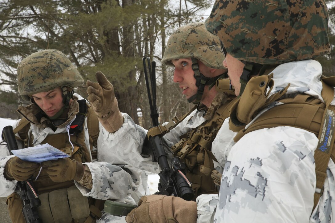Marines with Weapons Company, 1st Battalion, 24th Marines, 25th Marine Regiment, 4th Marine Division, navigate the route to their next checkpoint during the final exercise of exercise Nordic Frost on Camp Ethan Allen Training Site in Jericho, Vt., Jan. 22, 2018. The exercise allowed Marines to demonstrate their ability to operate in a cold weather mountainous environment, conducting land navigation, marksmanship training, demolitions, call for fire training and other core competencies. (U.S. Marine Corps photo by Pfc. Samantha Schwoch/released)