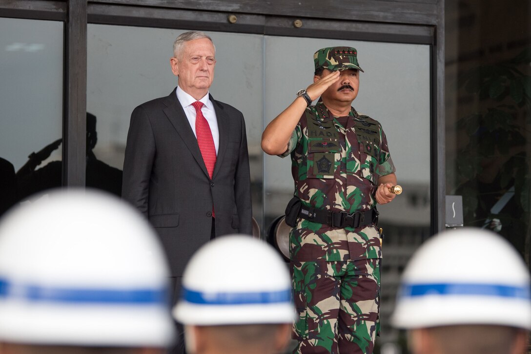 Defense Secretary James N. Mattis stands beside Indonesian Defense Chief Marshal Hadi Tjahjanto.
