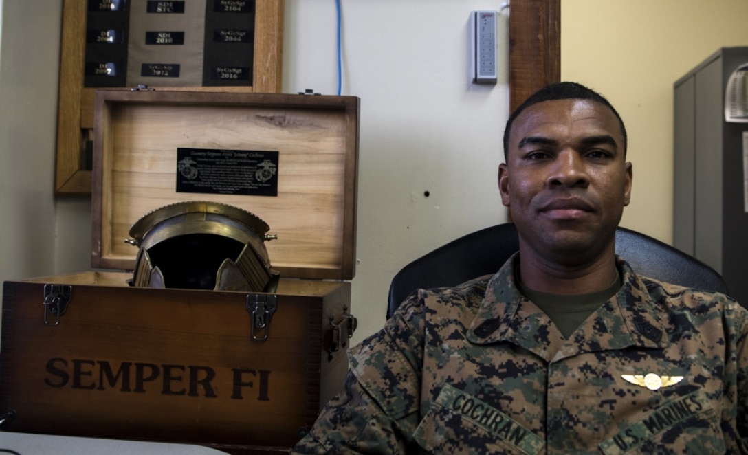 Master Sgt. Kevin O. Cochran, 1st Marine Aircraft Wing's current operations chief, poses with a few of his awards on Camp Foster, Okinawa, Japan, Jan. 10, 2018. Preparing to retire, Cochran, a Dayton, Ohio native, was recognized for assisting an Okinawan man out of his overturned vehicle Jan. 8, 2018. Cochran is a 23-year Marine Corps veteran. (U.S. Marine Corps photo by Cpl. Jess Etheridge)