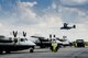 A CV-22 Osprey from Hurlburt Field, Fla. hovers over C-145 Skytrucks