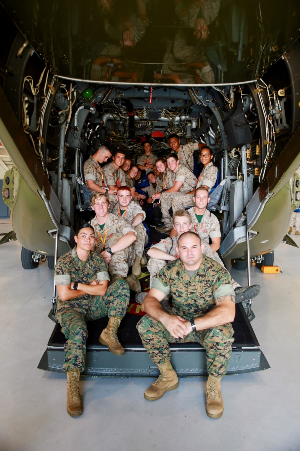 Summer Leadership and Character Development Academy (SLCDA) Company C students tour Marine Helicopter Squadron One (HMX-1) aboard Marine Corps Base Quantico, Quantico, Va., July 17, 2017. The SLCDA is a community outreach and social connection program developed by Marine Corps Recruiting Command's Individual Mobilized Augmentee Detachment and is based on the success of the United States Naval Academy Summer Seminar Program. The intent is to attract a diverse group of rising high school juniors and seniors from across the nation, who are service-oriented and academically sound. Throughout the week-long academy, students are exposed to the Marine Corps' core values of honor, courage and commitment, while learning and practicing concepts of leadership and service to others. (U.S. Marine Corps photo by Sgt. Courtney G. White/Released)
